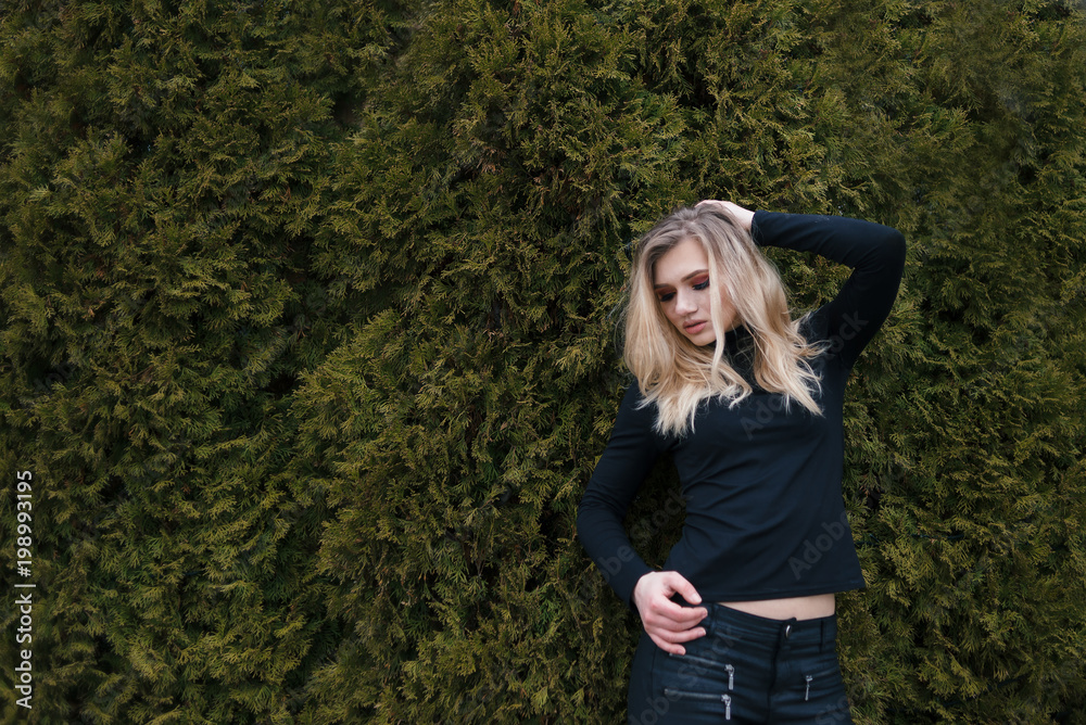 blonde raised her hand to her hair and looked down. blonde raised her hand to her hair and looked down.