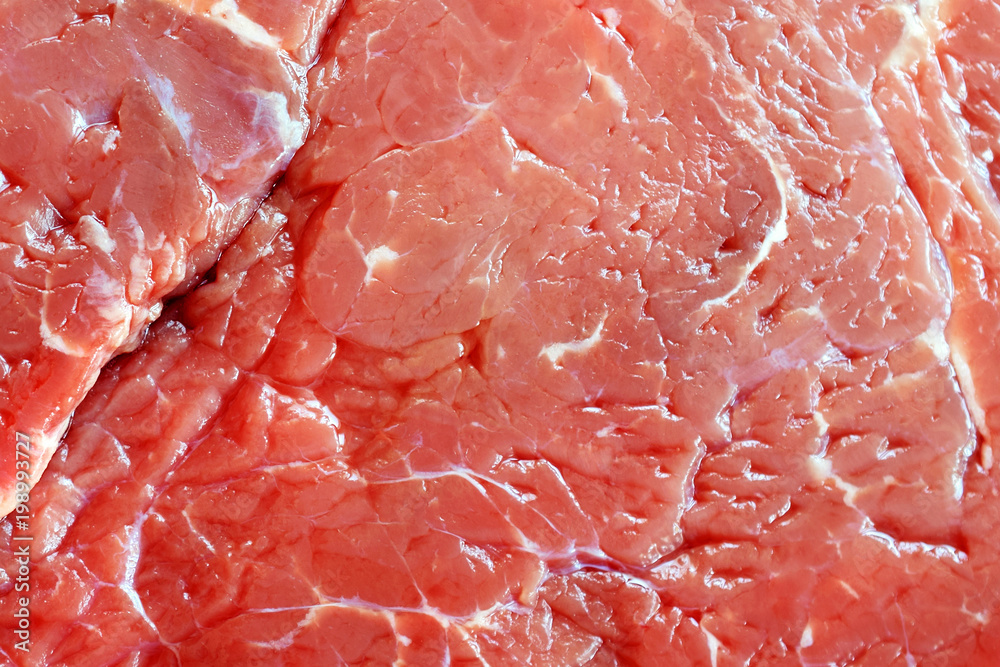 Raw beef sirloin steak close up texture. Raw beef sirloin steak close up texture.