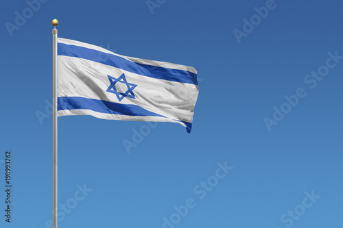 Flag of Israel in front of a clear blue sky
