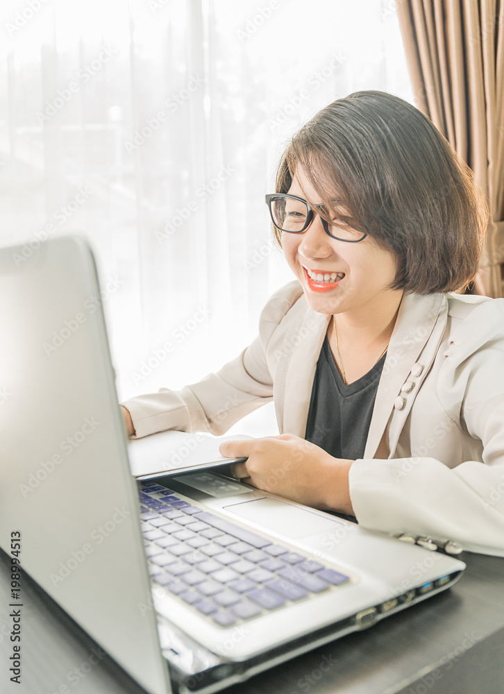 Woman teenage working on laptop in home office Woman teenage working on laptop in home office