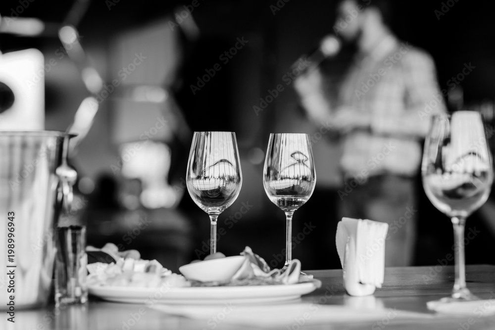 Wine tasting experience  with  glasses of wine on a table. Black and white background
