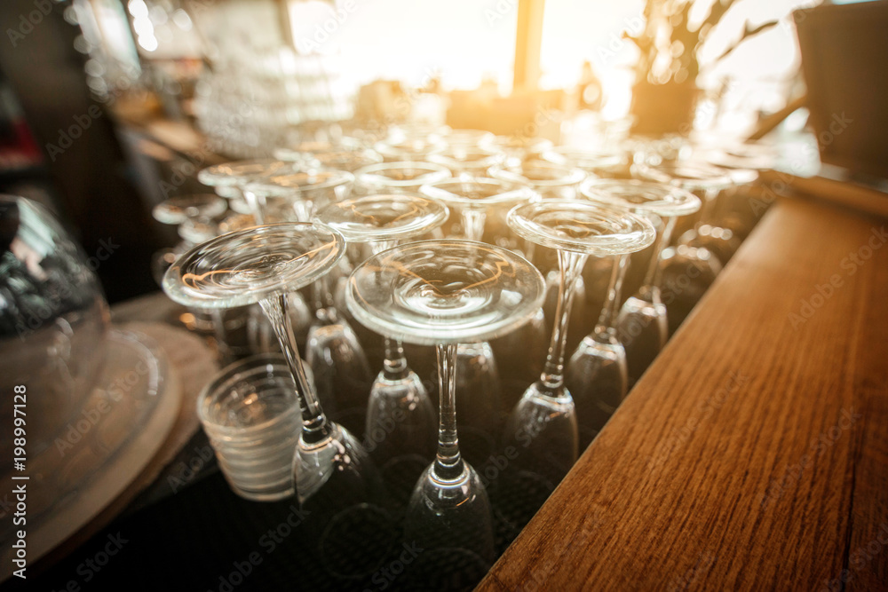 Empty inverted glasses on a table in a restaurant. Toned Empty inverted glasses on a table in a restaurant. Toned
