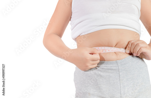 Fit fitness girl measuring her waistline