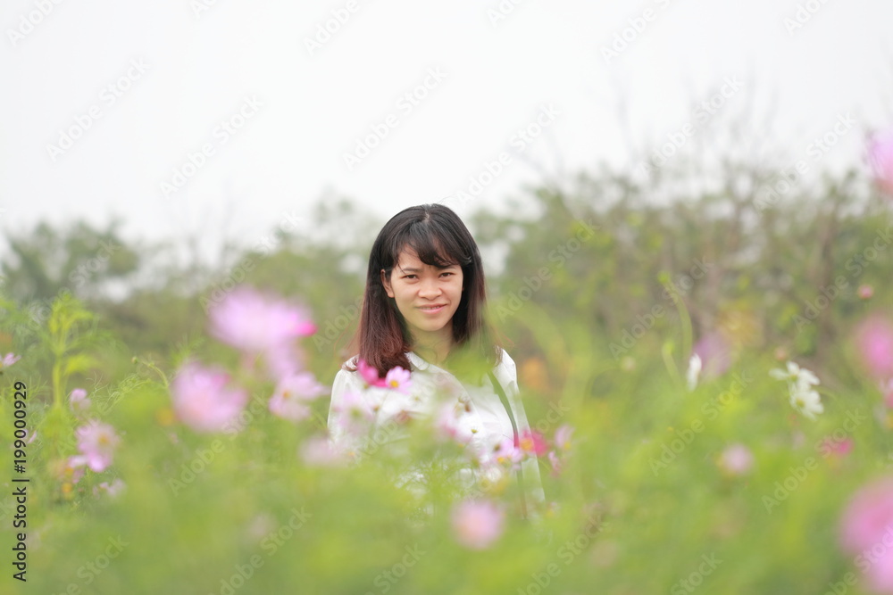 woman at the flower garden in Hanoi, Vietnam woman at the flower garden in Hanoi, Vietnam