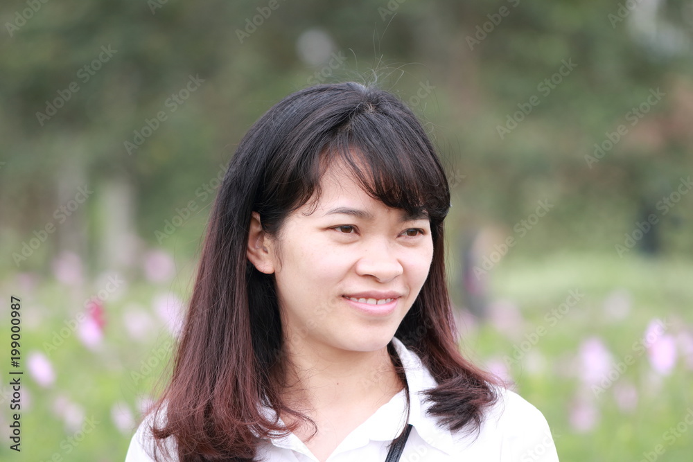 woman at the flower garden in Hanoi, Vietnam woman at the flower garden in Hanoi, Vietnam