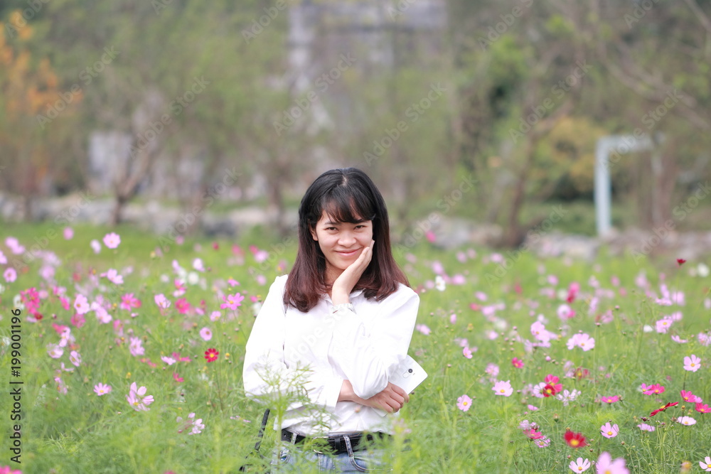 woman at the flower garden in Hanoi, Vietnam woman at the flower garden in Hanoi, Vietnam