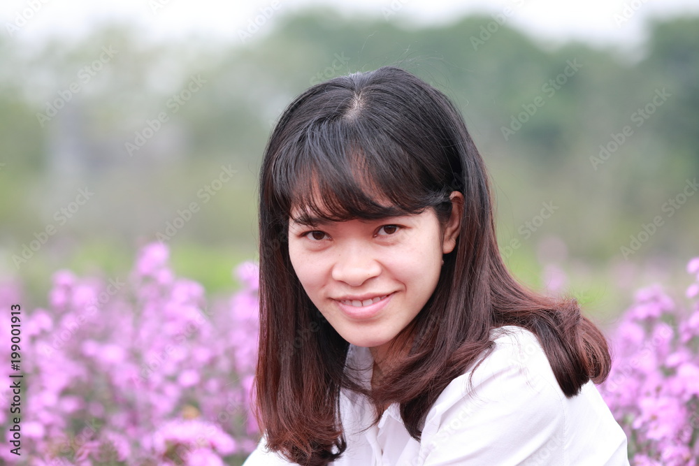 woman at the flower garden in Hanoi, Vietnam woman at the flower garden in Hanoi, Vietnam