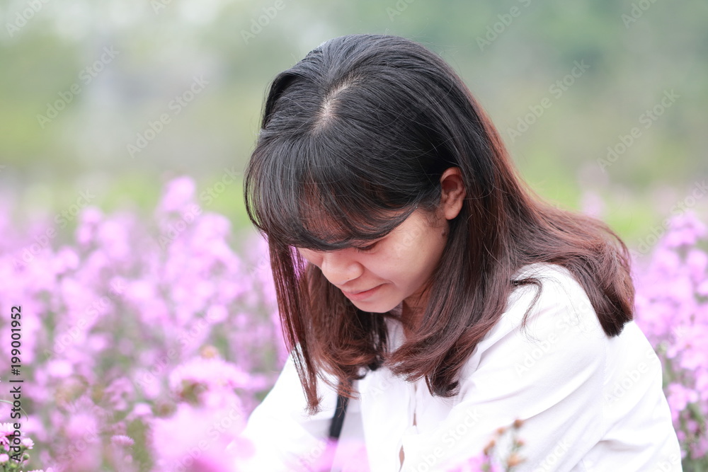woman at the flower garden in Hanoi, Vietnam woman at the flower garden in Hanoi, Vietnam
