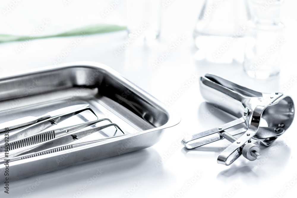 instruments of gynecologist on white background instruments of gynecologist on white background