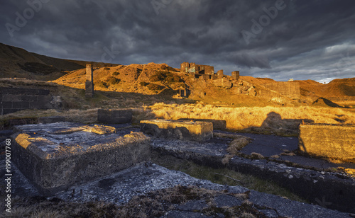 Abandoned Quarry Ruins in Warm Sunset Light photo