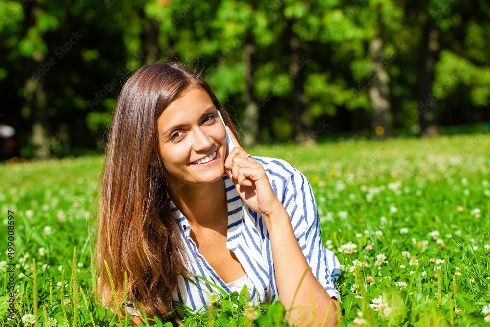 Portrait of beautiful caucasian smiling brunette young woman calling by phone Portrait of beautiful caucasian smiling brunette young woman calling by phone