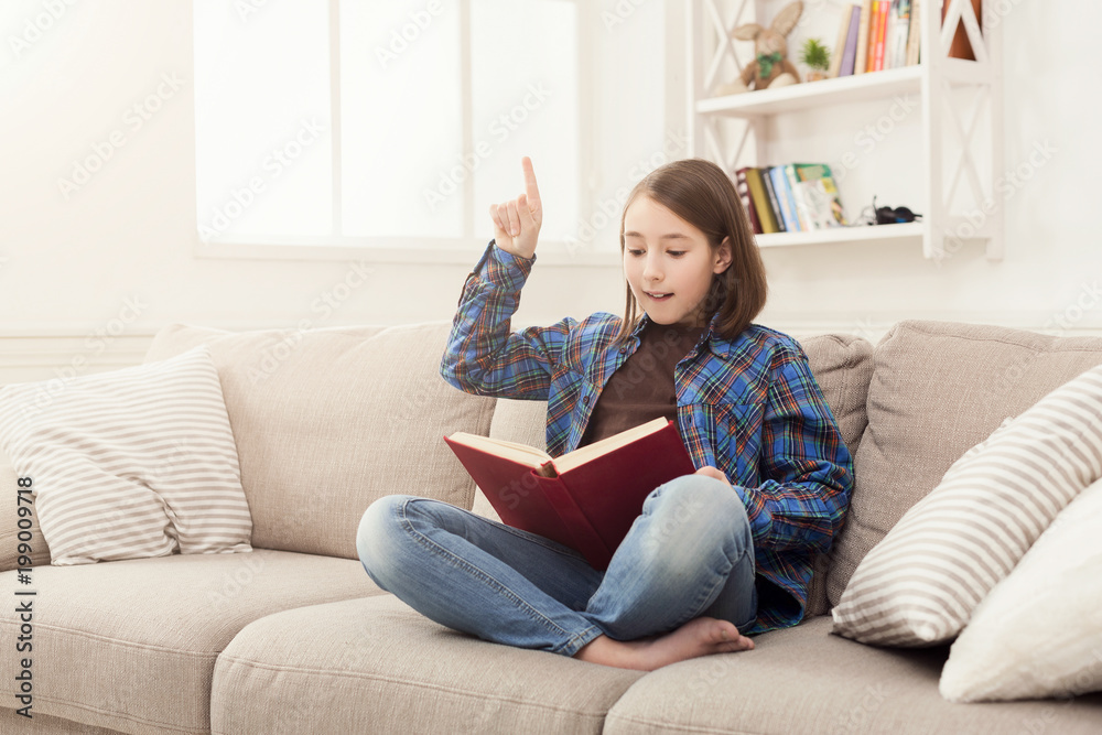 Cozy home. Young thoughtful girl with book Cozy home. Young thoughtful girl with book
