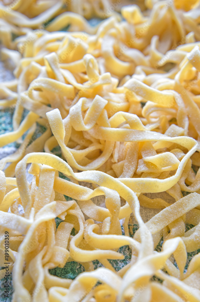 Italian fettuccine pasta closeup with copy space Italian fettuccine pasta closeup with copy space