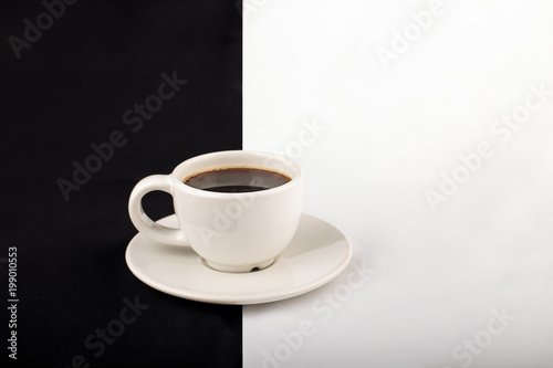 White cup of coffee against contrast background