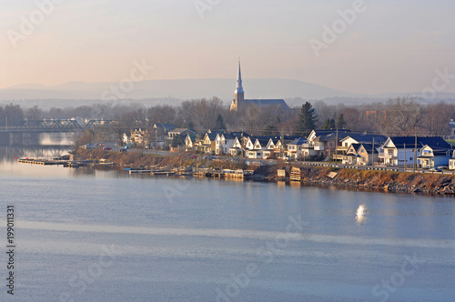 Pointe-Gatineau and Paroisse St-François-De-Sales Church at sunset in Gatineau, Quebec, from Ottawa across Ottawa River, Ontario, Canada. photo