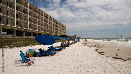 Sparsely attended beach on the Gulf of Mexico on Floridas pan handle.
