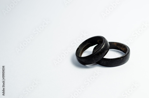 pair of coconut rings together on a white background. Intense black tone. Handicraft common in the northeast of Brazil. indigenous ring. Tucum ring. photo