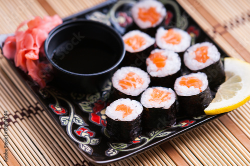 Sushi rolls with salmon, ginger and soy sauce 