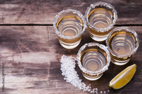 Tequila shots with lime fruit and salt 