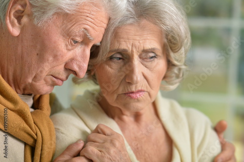 Portrait of sad senior couple 