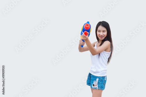 Asian sexy woman with water in hand on white background,Festival songkran day at thailand,The best of festival of thai,Land of smile