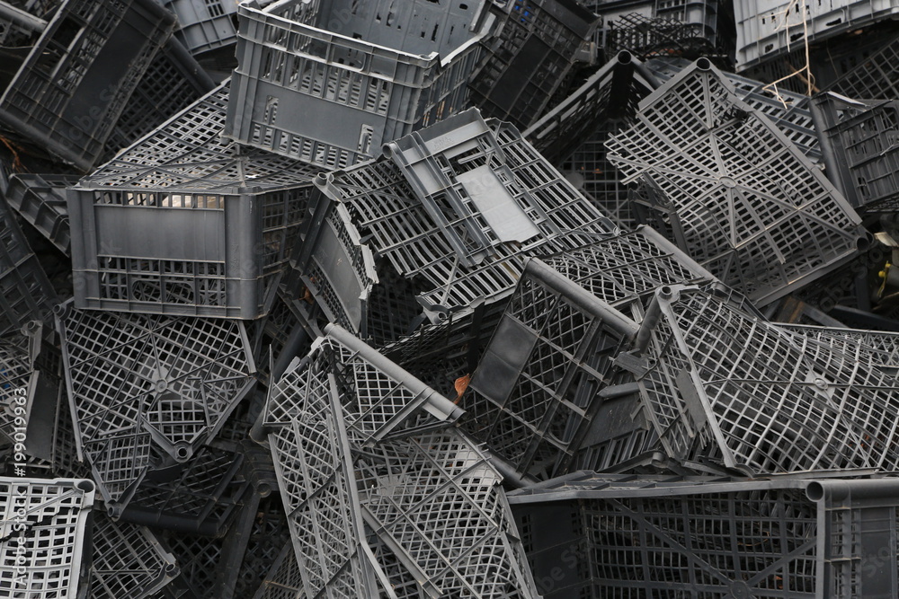 Fototapeta premium Piled black crates for scrap
