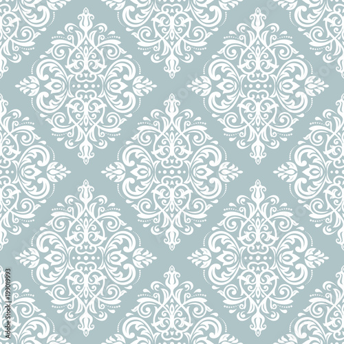 Damask classic light blue and white pattern. Seamless abstract background with repeating elements. Orient background