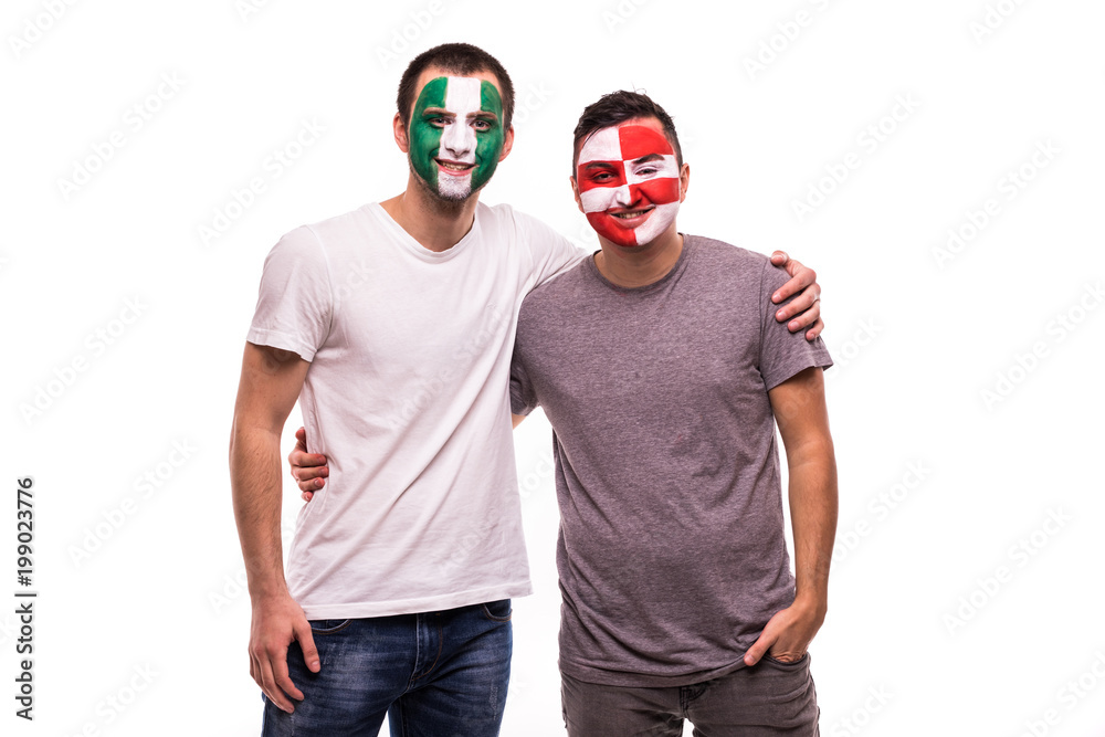 Football fans supporters with painted face of national teams of Nigeria and Croatia isolated on white background Football fans supporters with painted face of national teams of Nigeria and Croatia isolated on white background