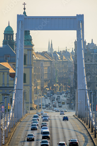 Budapest city downtown view trough Elisabeth bridge metal arch. Ttraffic photo