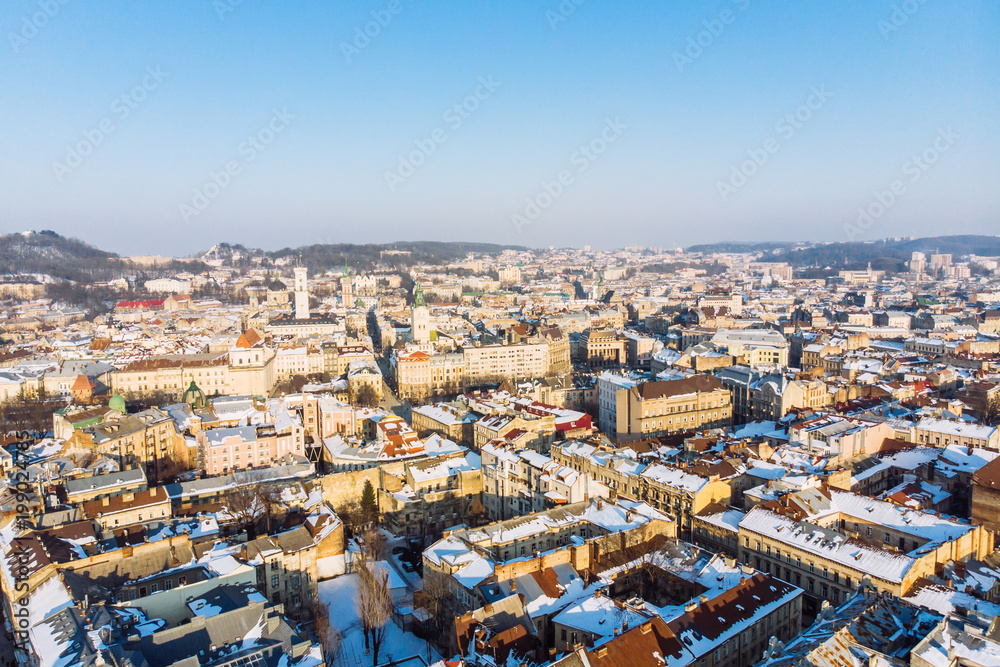 bird's eye view of old european city in winter day on sunset