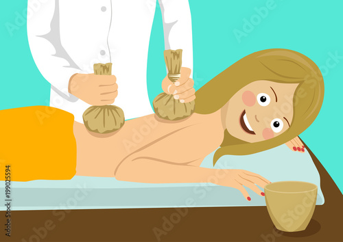 Young happy woman having hot back poultice massage in spa salon