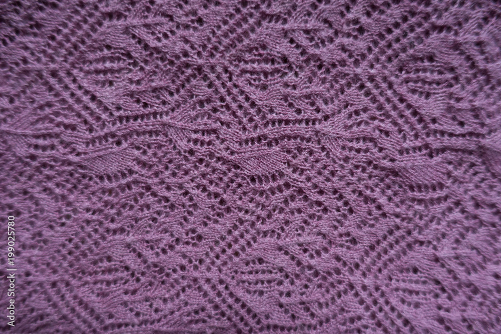 Pink handmade lacy knitting fabric from above