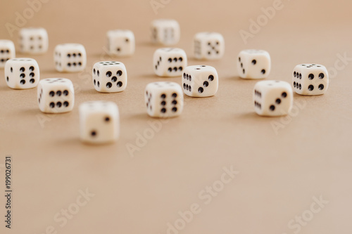 Set of gaming dice with copy space on brown background. Concept for games  game board  role playing game  risk  chance  good luck or gambling. Toned image top view. Close-up.