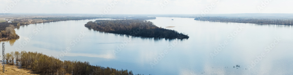 island in the middle of a wide river island in the middle of a wide river