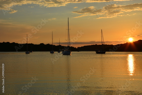 Sunset Sea Port with Sailboats