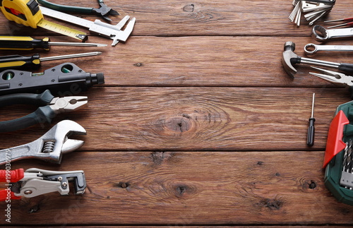 Repair tools on wood background with copy space