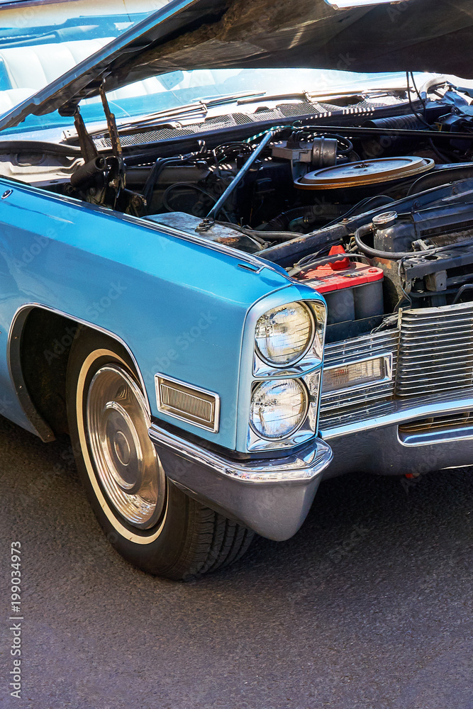 Retro car with open hood stands on the sidelines. - obrazy, fototapety, plakaty 