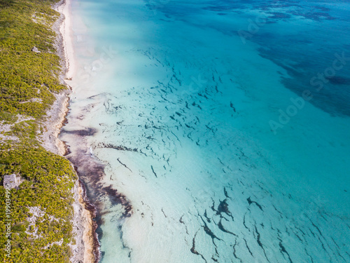 Sea Aerial view, Top view, amazing nature background. The color of the water and beautifully bright. Azure beach. Top view aerial photo from flying drone of an amazingly beautiful sea landscape.
