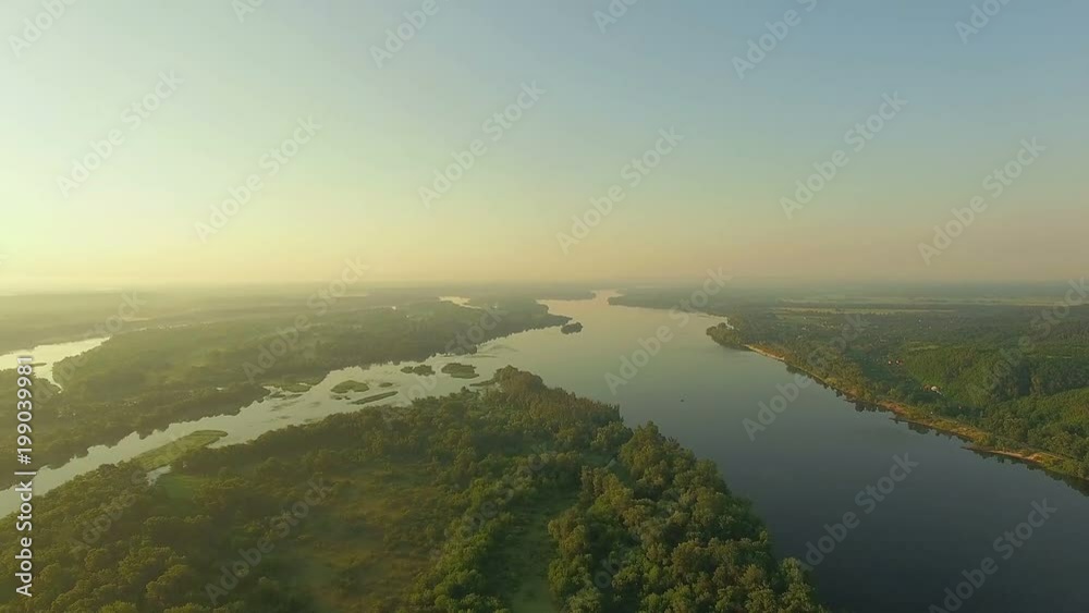 aerial view of river at sunrise 4K, forest and river in morning mist, Very high view of the river forest at sunrise, Aerial view of mystical river at sunrise with fog, sun above the river aerial