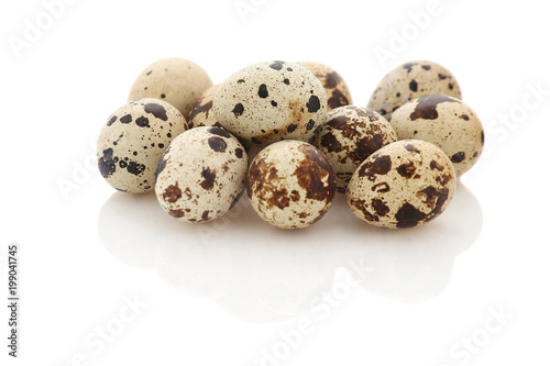 pile of quail eggs on white background isolate