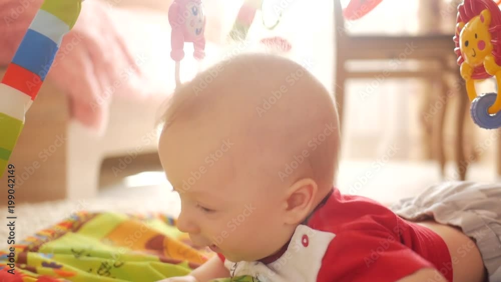 Adorable little boy playing in children room Adorable little boy playing in children room