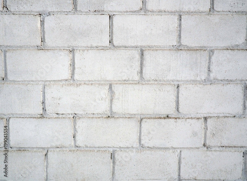 Close-up of white brick wall texture pattern for background and wallpaper. High-quality macro photography.