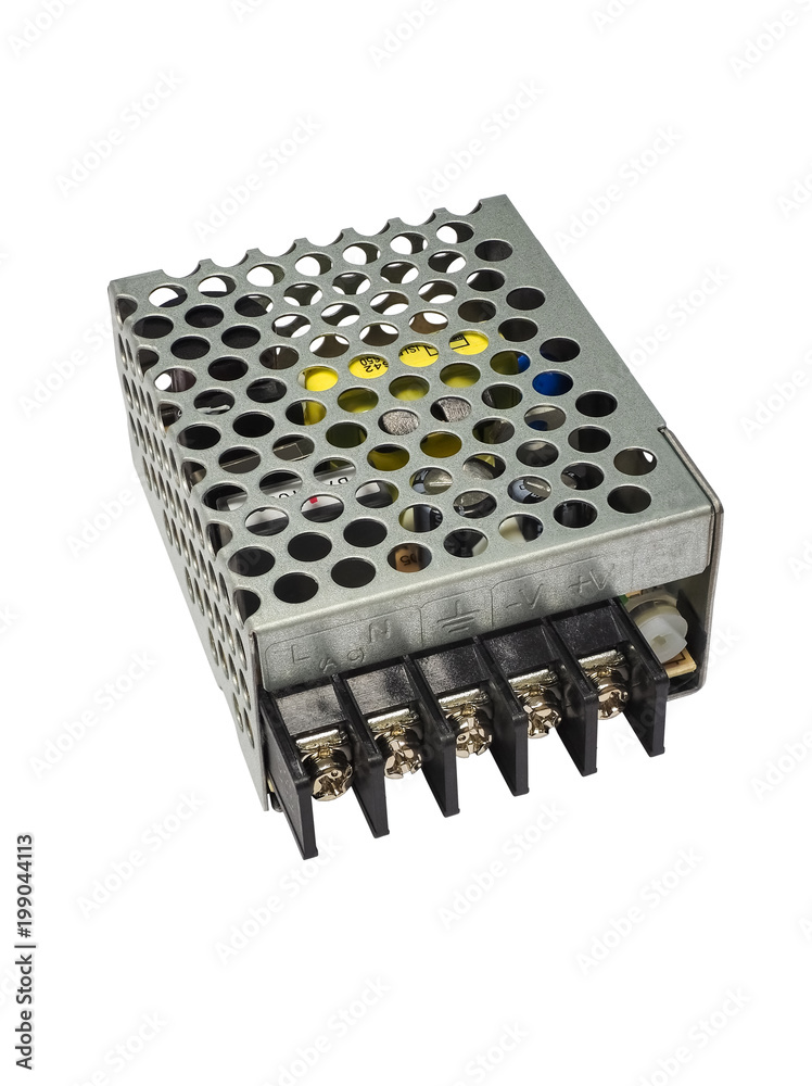 Close-up AC DC power supply with transformer and electronic components with radiators. Isolated on white background. High quality macro photography. Close-up AC DC power supply with transformer and electronic components with radiators. Isolated on white background. High quality macro photography.