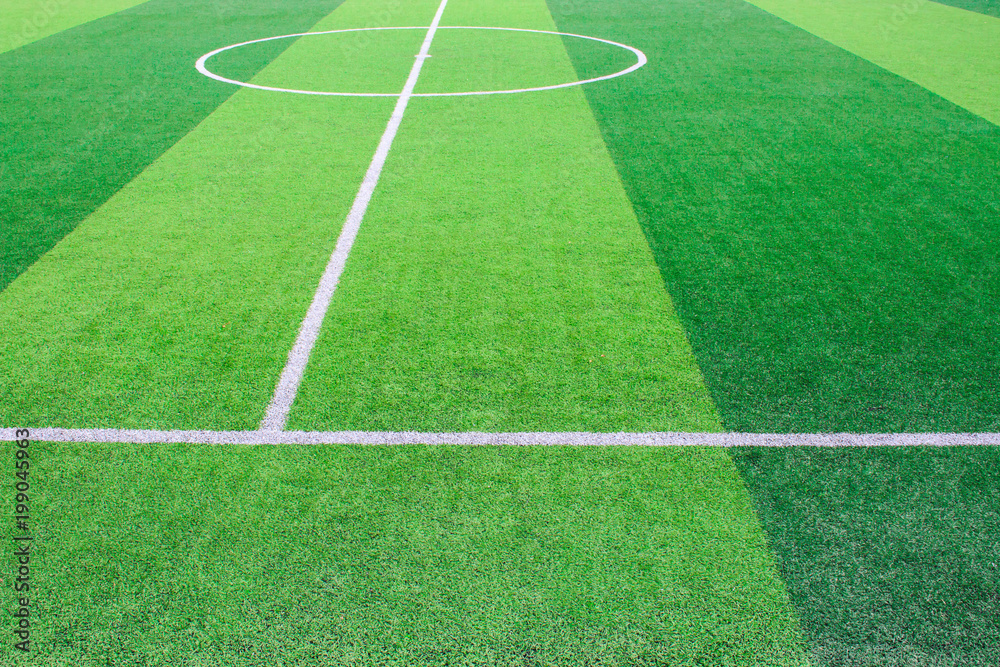 The white Line marking on the artificial green grass soccer field