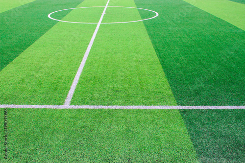 Obraz na płótnie The white Line marking on the artificial green grass soccer field w salonie