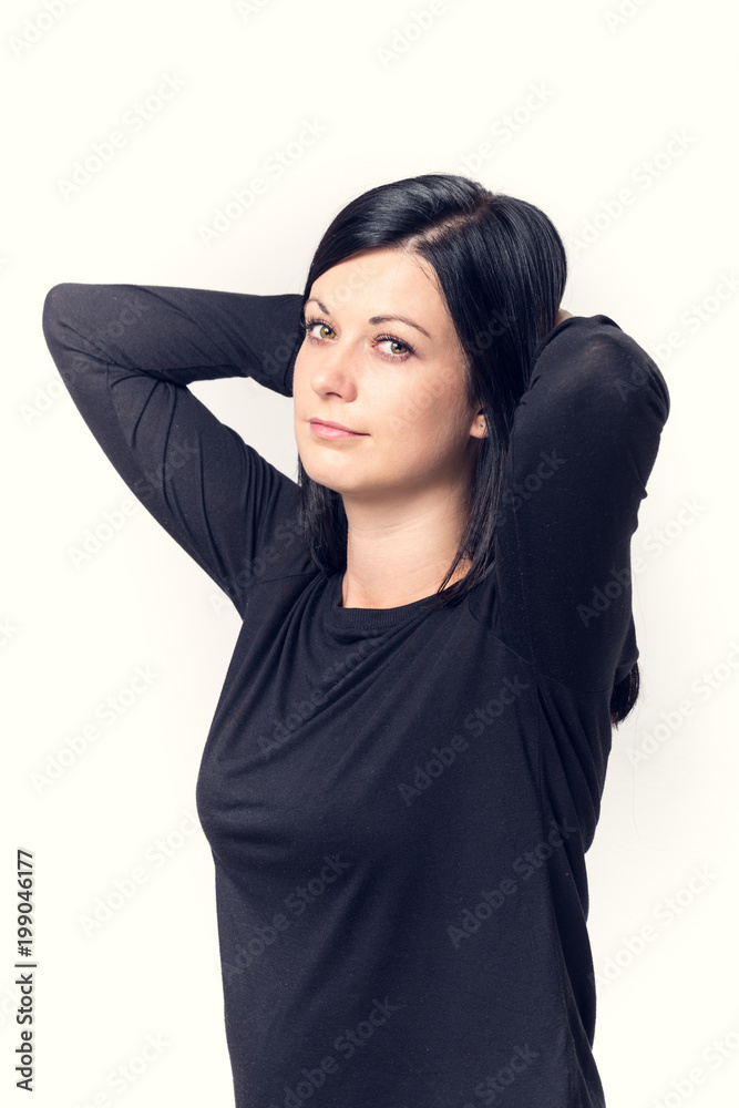young woman in black hair on a light background young woman in black hair on a light background