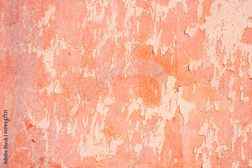 Wall with peeled pink paint - a nice shabby background Wall with peeled pink paint - a nice shabby background