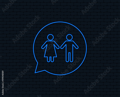 Neon light. Toilet sign icon. Restroom or lavatory speech bubble symbol. Glowing graphic design. Brick wall. Vector