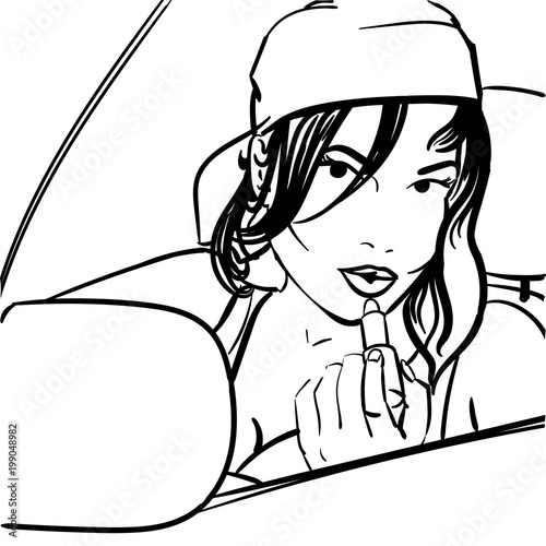 A girl paints her lips with a pomade in a car