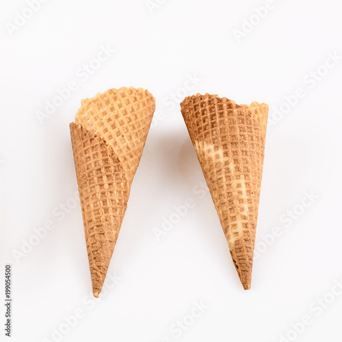 empty ice cream cone on neutral background